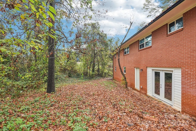 view of yard featuring french doors