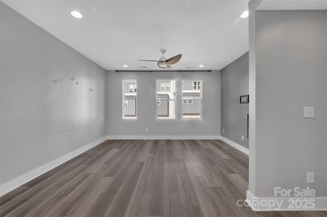 unfurnished living room featuring dark wood-style floors, baseboards, a ceiling fan, and recessed lighting