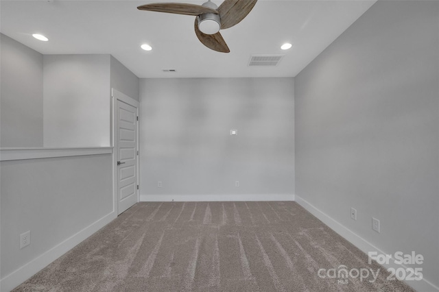spare room with a ceiling fan, visible vents, recessed lighting, carpet floors, and baseboards