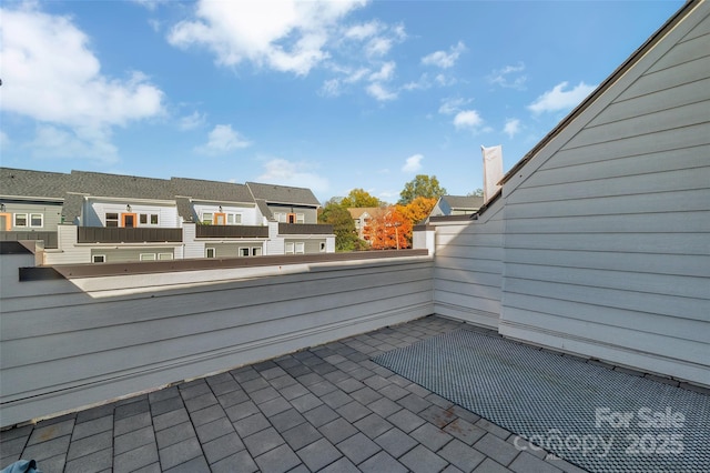 view of patio / terrace with a residential view and a balcony