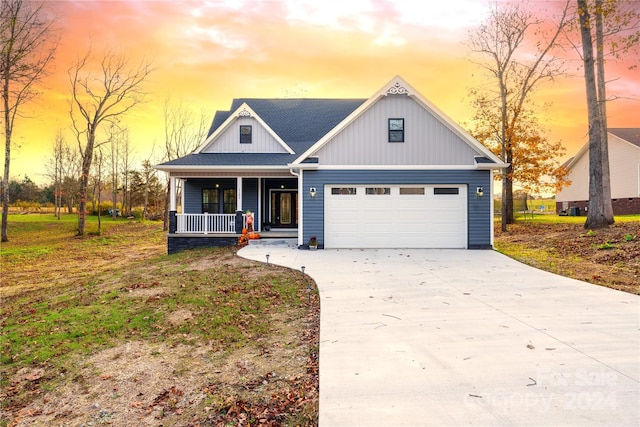 view of front of home with a garage and covered porch