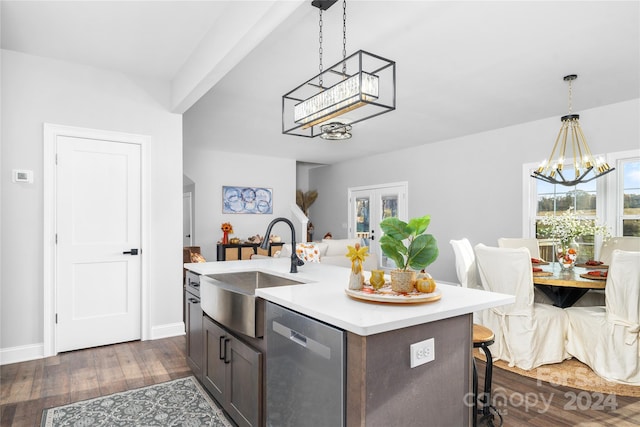 kitchen featuring dishwasher, an inviting chandelier, a center island with sink, sink, and dark hardwood / wood-style flooring