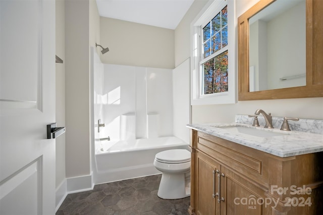 full bathroom featuring washtub / shower combination, tile patterned floors, vanity, and toilet