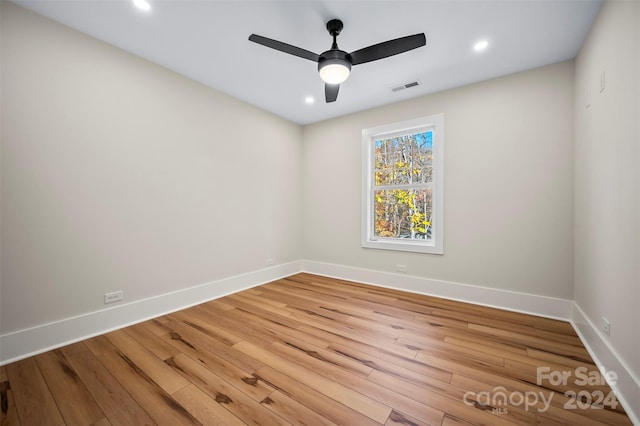 empty room with wood-type flooring and ceiling fan