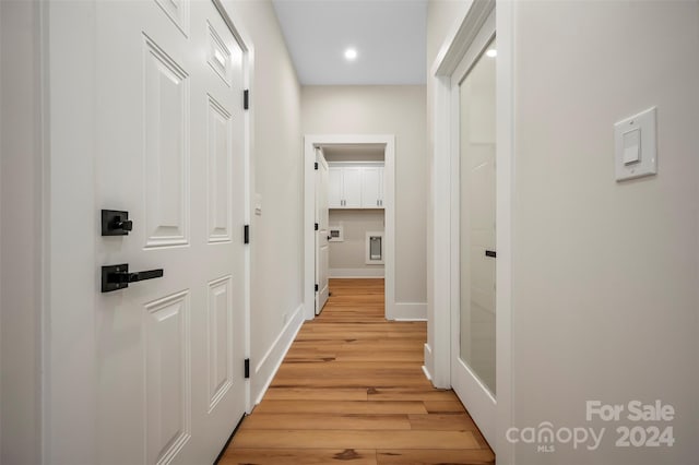 corridor featuring light hardwood / wood-style floors