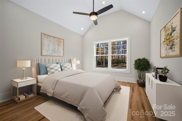 bedroom featuring lofted ceiling, light wood-style flooring, a ceiling fan, recessed lighting, and baseboards