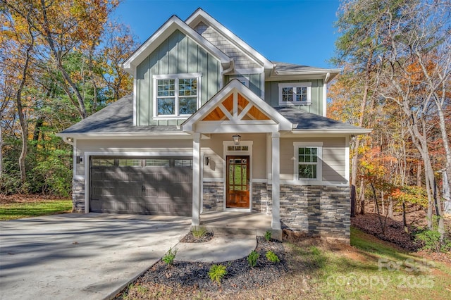 492 Mountain View Dr, Columbus, NC 28722 - craftsman-style home featuring board and batten siding, concrete driveway, an attached garage, and stone siding