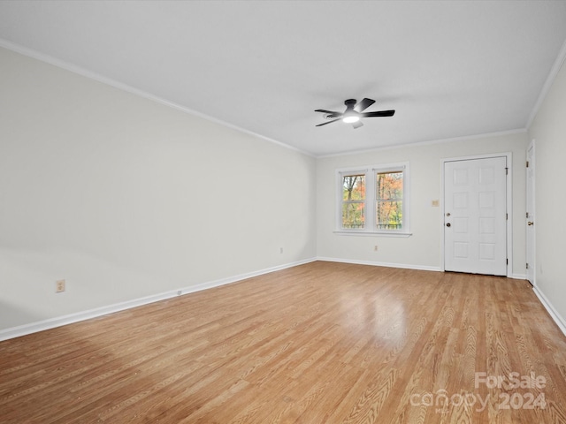 unfurnished room with light hardwood / wood-style flooring, ceiling fan, and crown molding