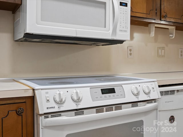 interior space featuring white appliances