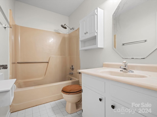 full bathroom with bathtub / shower combination, vanity, tile patterned floors, and toilet