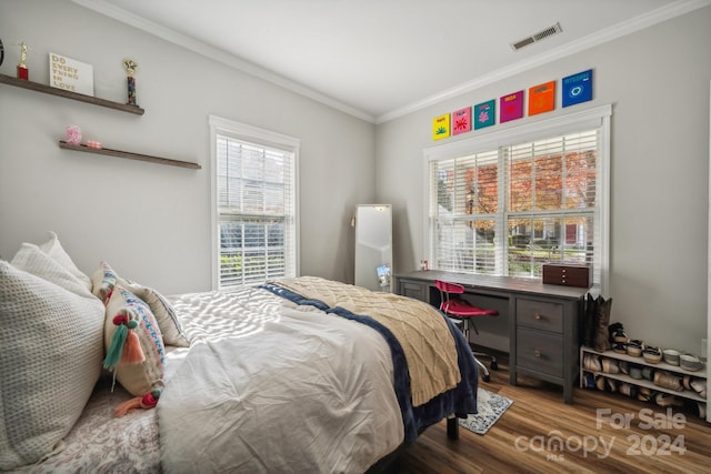 bedroom featuring wood-type flooring and ornamental molding