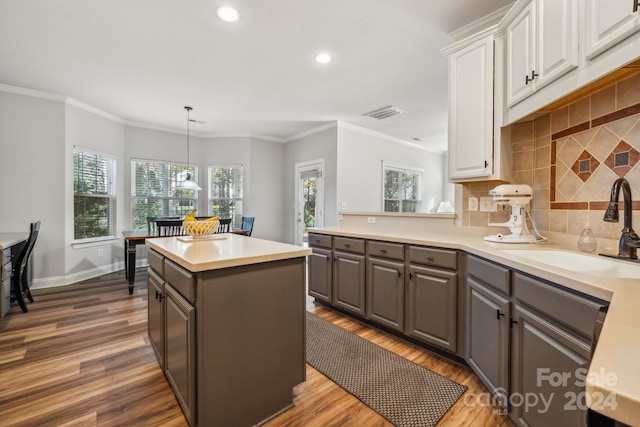 kitchen with gray cabinetry, pendant lighting, decorative backsplash, dark hardwood / wood-style flooring, and white cabinetry