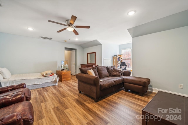 living room with ceiling fan and wood-type flooring