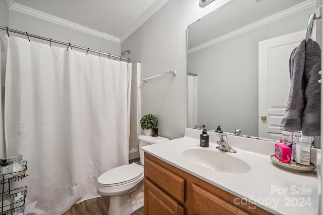 bathroom featuring crown molding, toilet, hardwood / wood-style flooring, vanity, and a shower with shower curtain