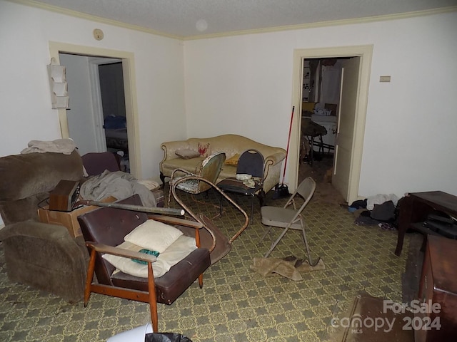 living room with a textured ceiling, ornamental molding, and carpet floors