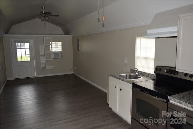 kitchen featuring electric stove, sink, vaulted ceiling, ceiling fan, and white cabinetry