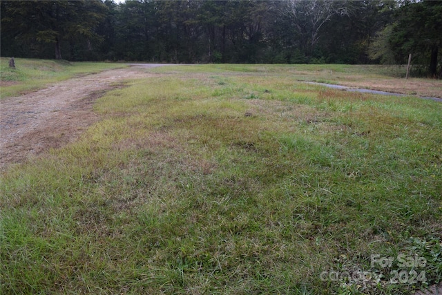 view of yard with a rural view