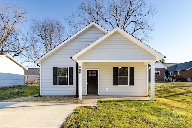 bungalow-style house featuring a porch and a front yard