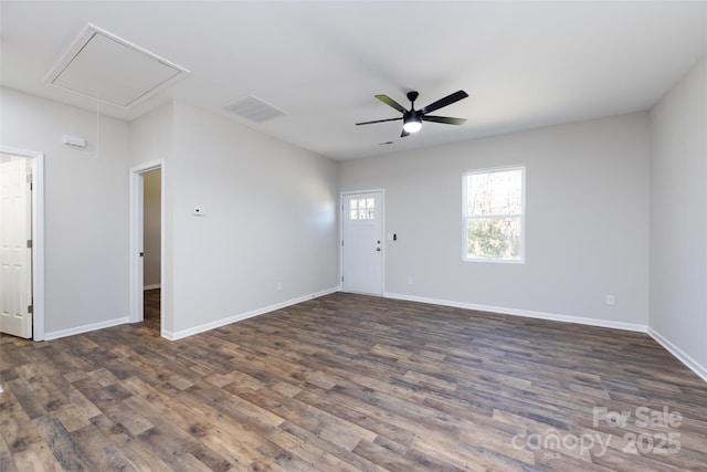 unfurnished room with dark hardwood / wood-style flooring and ceiling fan