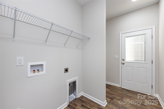 clothes washing area featuring electric dryer hookup, dark hardwood / wood-style flooring, and hookup for a washing machine