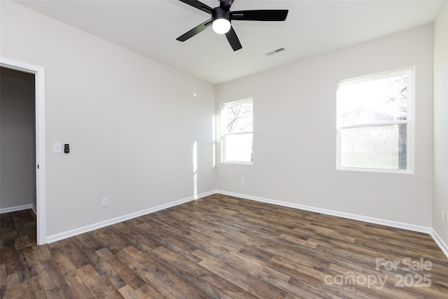 unfurnished room featuring ceiling fan and dark hardwood / wood-style flooring