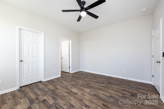 unfurnished bedroom with ceiling fan and dark wood-type flooring