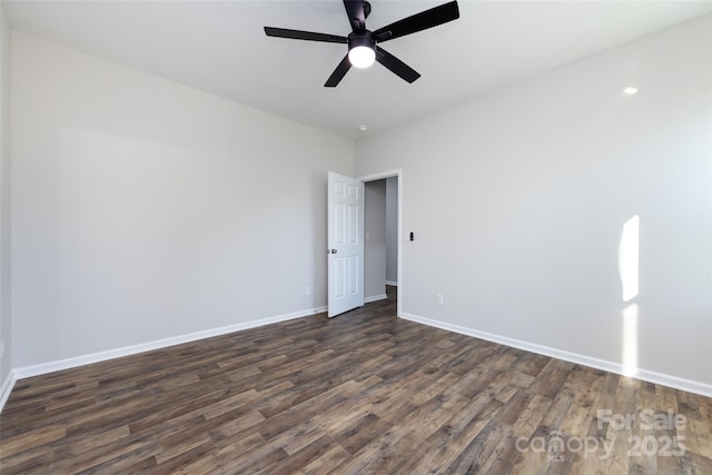 unfurnished room featuring ceiling fan and dark wood-type flooring