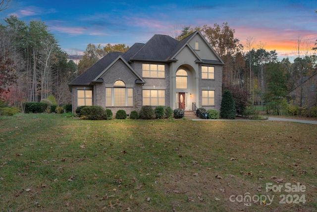 view of front of property with a lawn