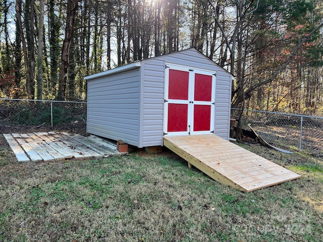 view of outdoor structure featuring a lawn