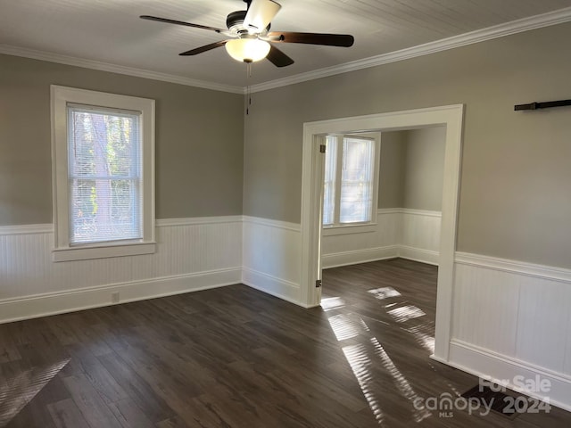 unfurnished room with crown molding, dark hardwood / wood-style flooring, and ceiling fan