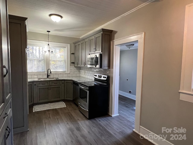 4541 Hall Dairy Rd, Claremont, NC 28610 - kitchen with stainless steel appliances, a sink, backsplash, dark wood finished floors, and crown molding