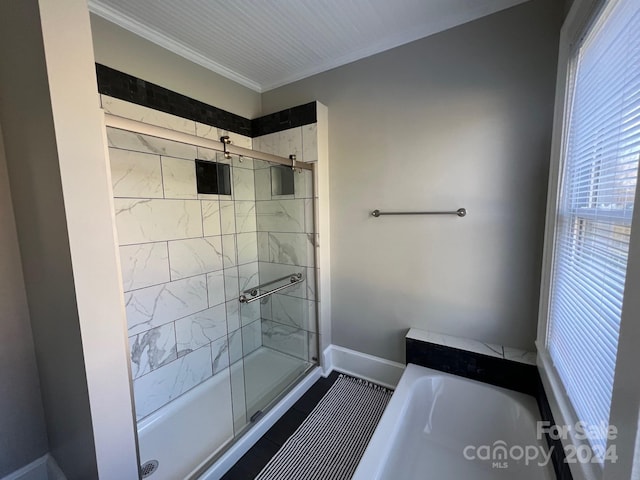 bathroom with separate shower and tub and crown molding