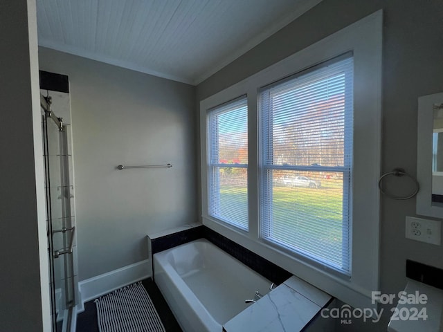 bathroom with independent shower and bath and crown molding