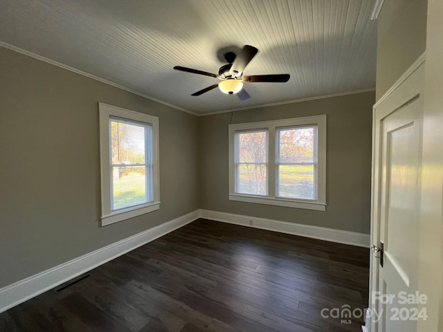 empty room featuring crown molding, ceiling fan, and dark wood-type flooring