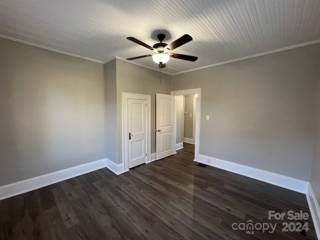 unfurnished bedroom featuring ceiling fan, crown molding, and dark wood-type flooring