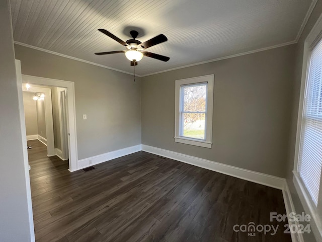 spare room with dark hardwood / wood-style floors, ceiling fan, and crown molding