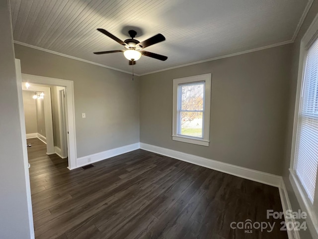 4541 Hall Dairy Rd, Claremont, NC 28610 - spare room featuring dark wood finished floors, baseboards, ceiling fan, and crown molding