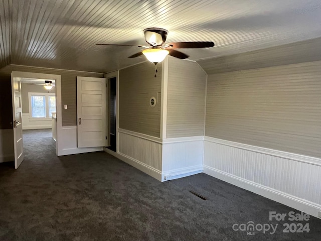 4541 Hall Dairy Rd, Claremont, NC 28610 - unfurnished room with ceiling fan, dark colored carpet, and wainscoting