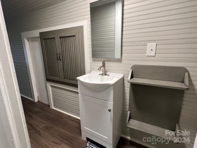 4541 Hall Dairy Rd, Claremont, NC 28610 - bathroom with vanity, wood walls, and wood finished floors