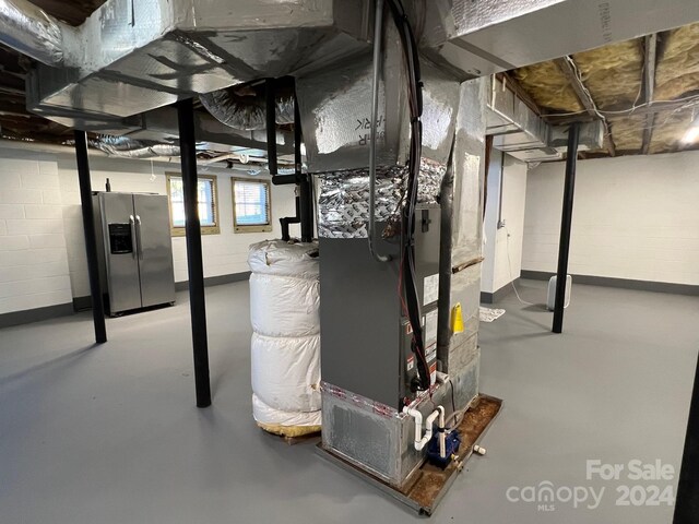 4541 Hall Dairy Rd, Claremont, NC 28610 - basement with stainless steel fridge