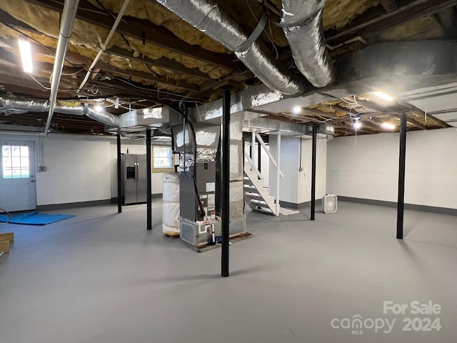 4541 Hall Dairy Rd, Claremont, NC 28610 - basement featuring heating unit and plenty of natural light