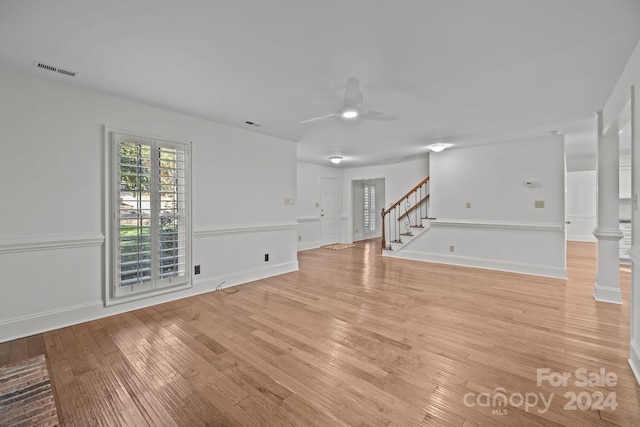 unfurnished living room with ceiling fan and light hardwood / wood-style flooring