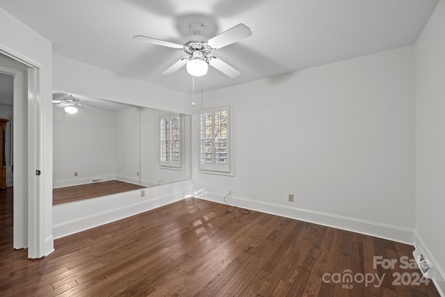 empty room with hardwood / wood-style flooring and ceiling fan