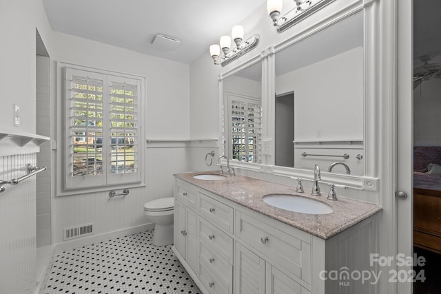 bathroom with vanity and toilet