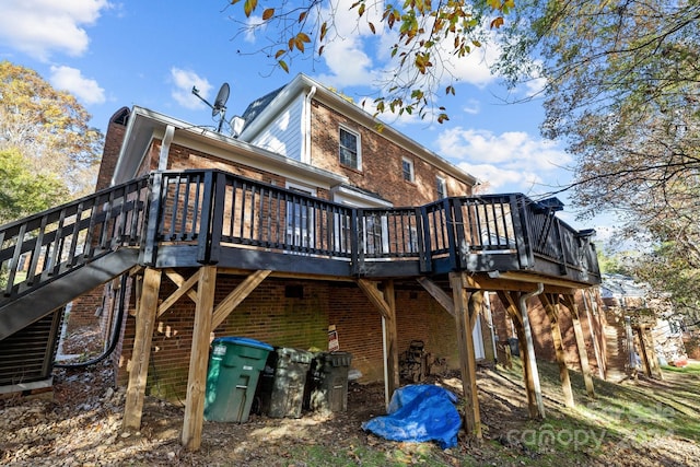 back of property with a wooden deck