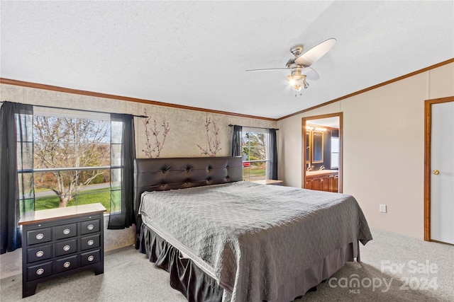 carpeted bedroom with a textured ceiling, multiple windows, ceiling fan, and lofted ceiling