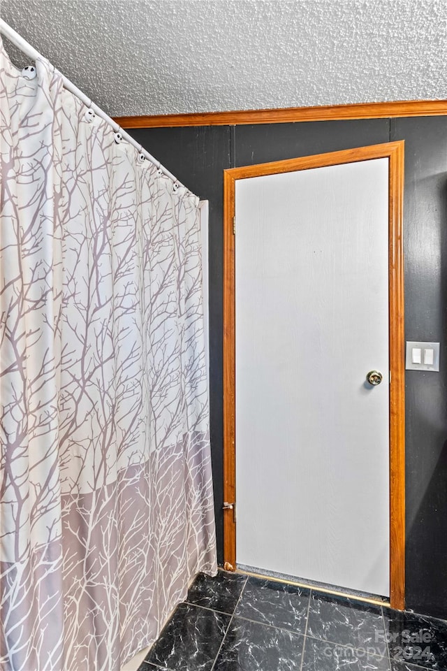 bathroom with a textured ceiling