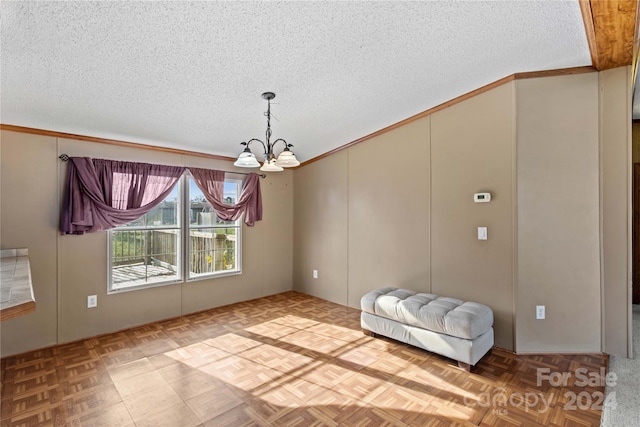 unfurnished room featuring crown molding, parquet floors, a textured ceiling, and a chandelier