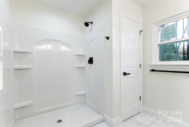 bathroom featuring tile patterned floors and walk in shower