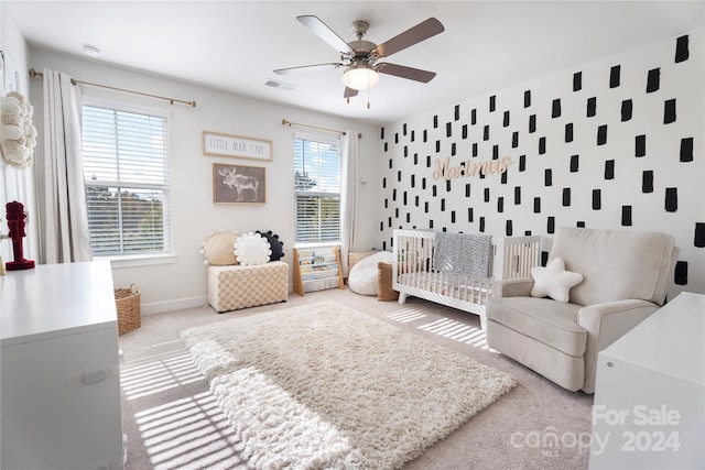 carpeted living room featuring ceiling fan